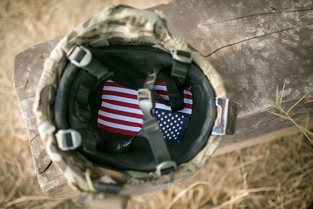 An American flag lines the inside of a U.S. Soldier's helmet at Forward Operating Base Azim Jan Karez in Kandahar…