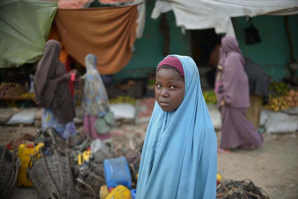 A young Somali girl walks through a market in Merca on 2 February.