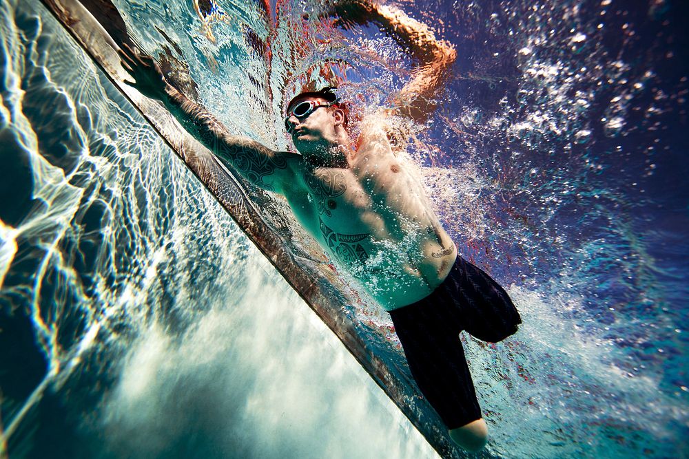 Joe Townsend, a British Royal Marine veteran, swims a timed 50-meter freestyle during the first day of practice at the…