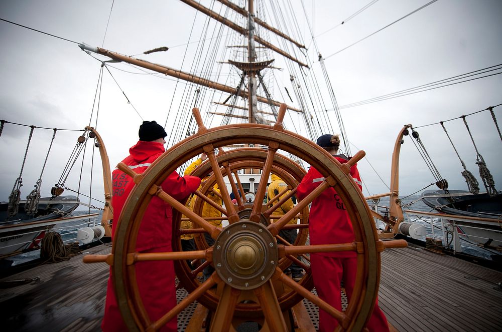 ATLANTIC OCEAN -- Coast Guard Cutter Eagle crewmembers and officer candidates stand helm watch through the storm March 12…