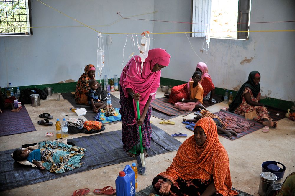 A woman sweeps the floor at a makeshift medical clinic in the city of Belet Weyne, Somalia, on March 30.