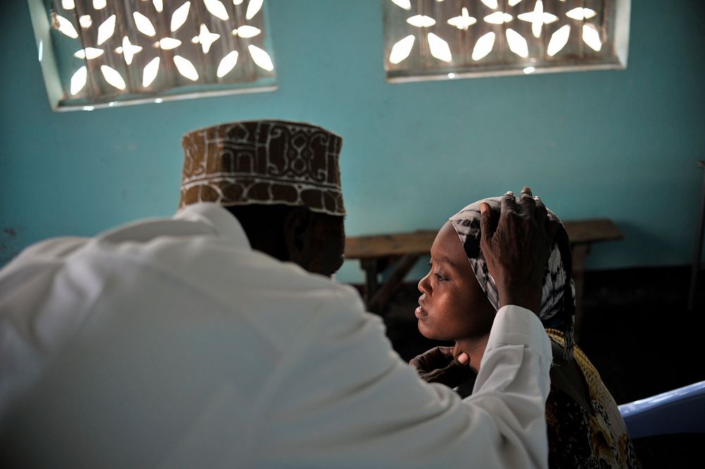 A doctor examines a patient at the Mother and Child Health Center during a visit by the Special Representative of the…