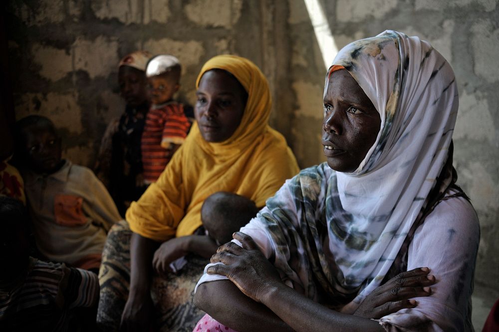 Women and their babies wait patiently at a medical clinic in Mogadishu, Somalia.