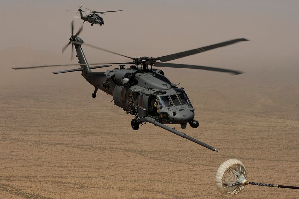 U.S. Army UH-60 Black Hawk helicopters with the New York Army National Guard prepare to conduct aerial refueling operations…