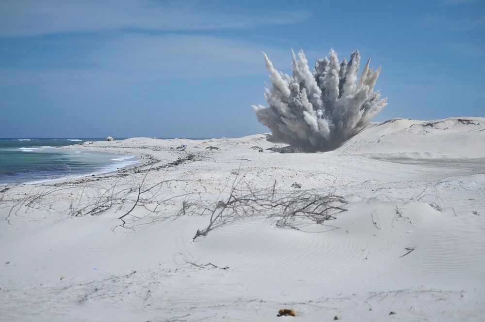 Unexploded ordinances (UXOs) are destroyed outside of Mogadishu at a safe location. Original public domain image from Flickr