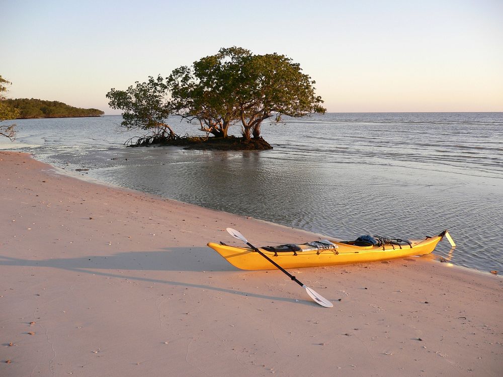 Free Kayak by the beach, public domain image. Original public domain image from Flickr