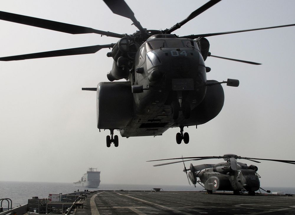 A U.S. Navy MH-53E Sea Dragon helicopter assigned to Helicopter Mine Countermeasures Squadron (HM) 15 takes off from the…