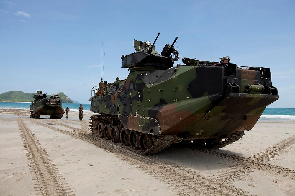 U.S. Marines with the 3rd Marine Division, III Marine Expeditionary Force position their assault amphibious vehicles on the…