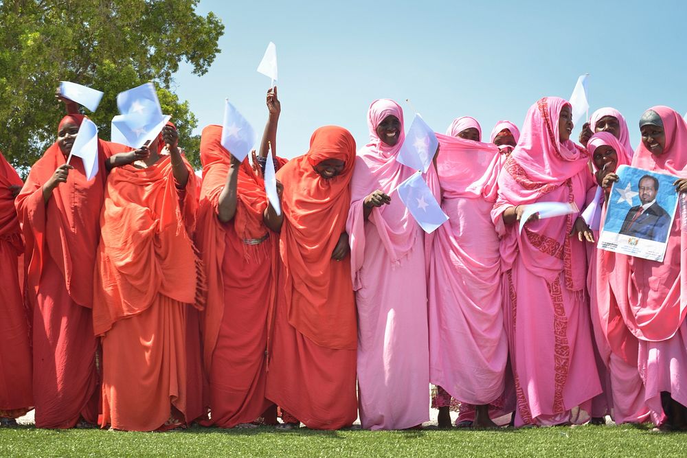 Women wave Somali flags during a celebration to mark Somalia's Independence Day at Konis stadium in Mogadishu on July 1.…