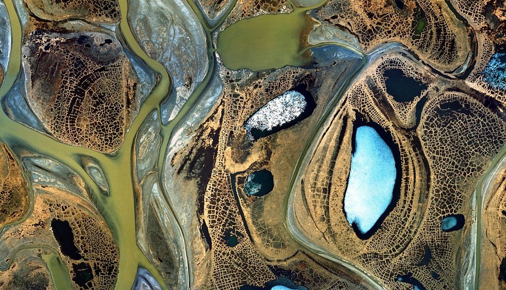 Open water and floating ice ponds,lakes and river channels in the Sagavanirktok River Delta in Alaska's North Slope.