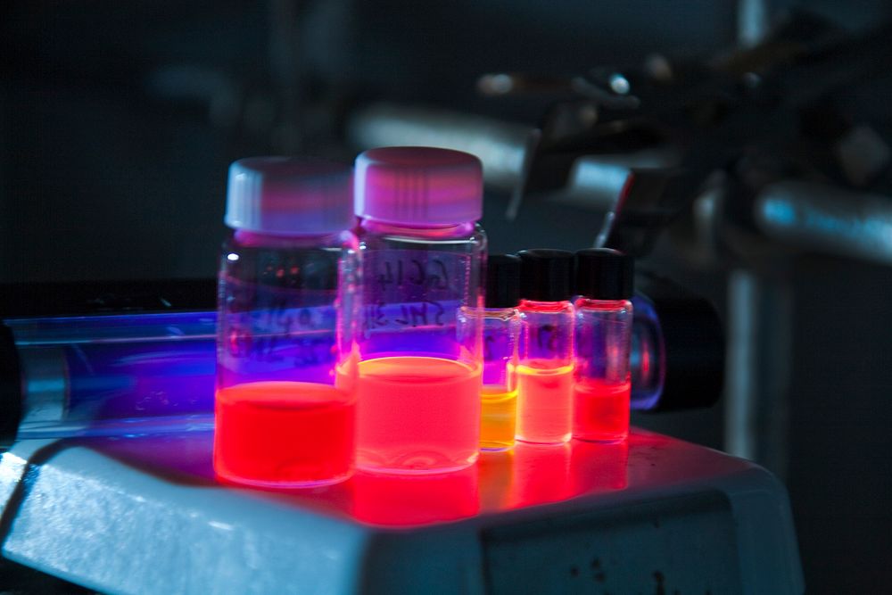 At Los Alamos, shown are vials of different-size nanocrystals, each emitting light of a different color (energy) that…