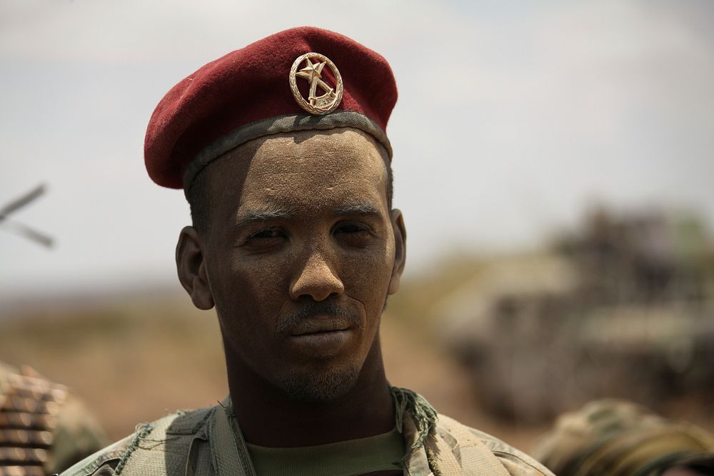 A member of the Somali National Army stands guard after having traveled overland to a meeting held by AMISOM on Aug. 29 in…