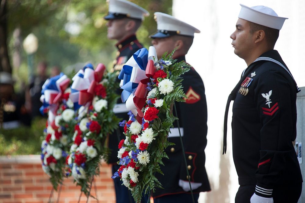 U.S. Marines and Sailors stand during an observance ceremony at the Beirut Memorial in Jacksonville, N.C., Oct. 23, 2013.