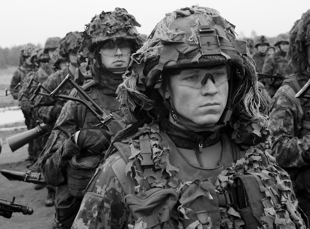 Estonian Defense Forces service members stand in formation during the opening ceremony for the live exercise portion of…