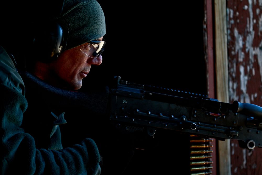 U.S. Air Force Tech. Sgt. Jack Baum mans an M240B machine gun while playing as an opposing forces member during military…