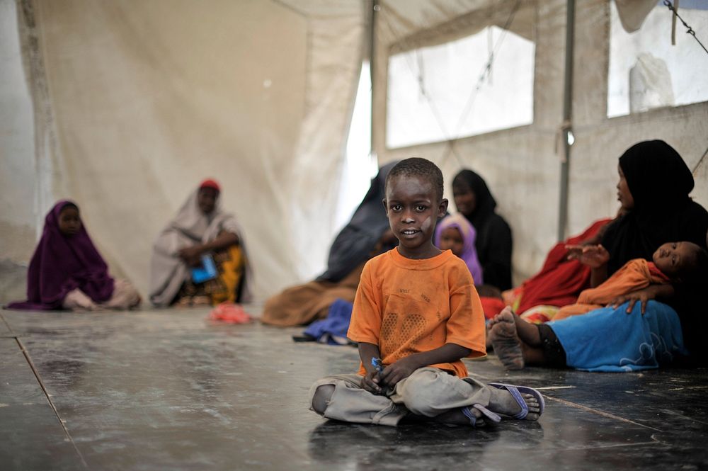 A young boy waits to be seen by a doctor during an outpatient day held at an AMISOM medical center on December 11 in…