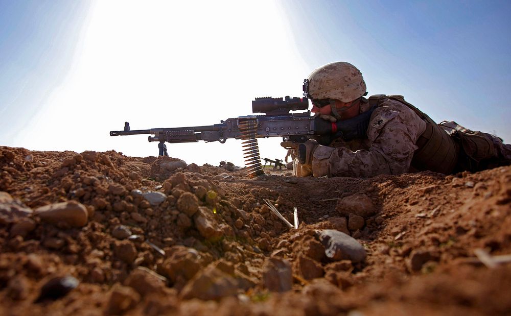 FirepowerA Marine with Bravo Company, 1st Battalion, 9th Marine Regiment, provides security during a clearing operation in…