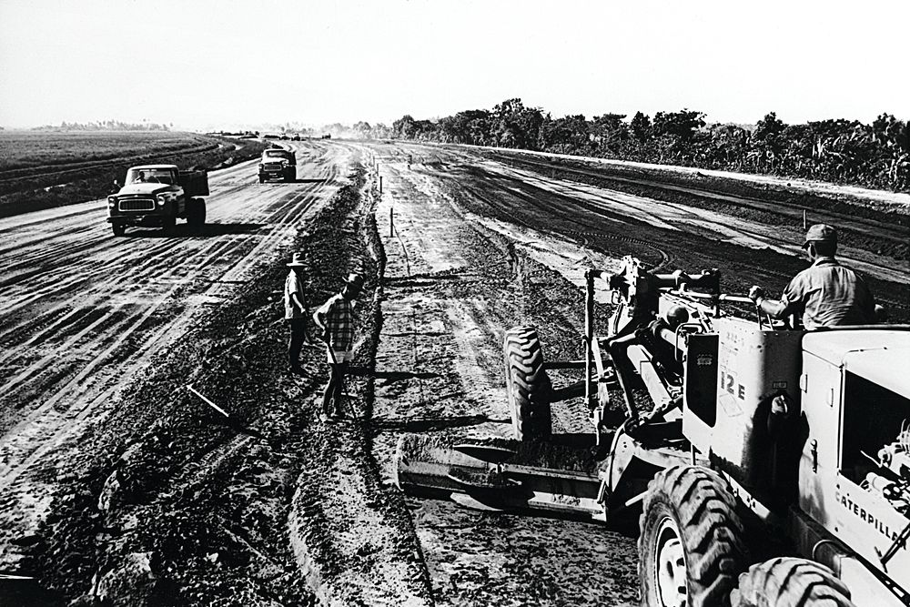 USAID in Indonesia: Dye AID in Indonesia. Road construction. U.S. National Archives. Original public domain image from Flickr