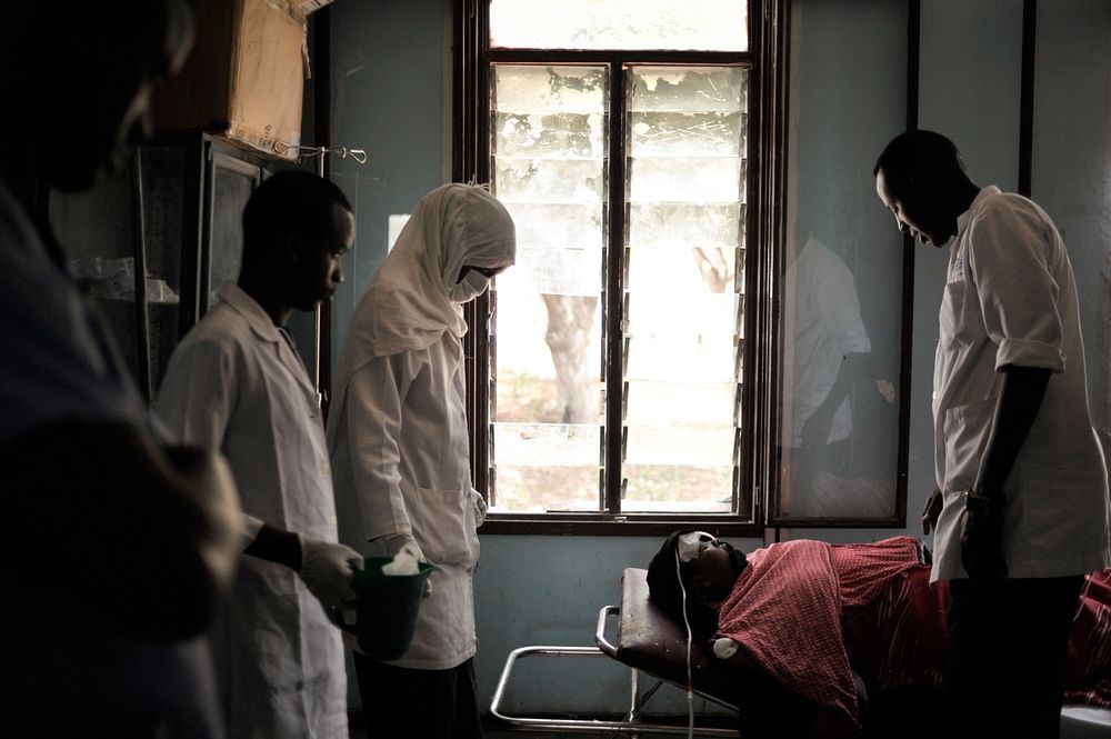 Nurses at Madina Hospital in Mogadishu, Somalia, attend to a woman in the hospital's emergency room on February 20. AU UN…