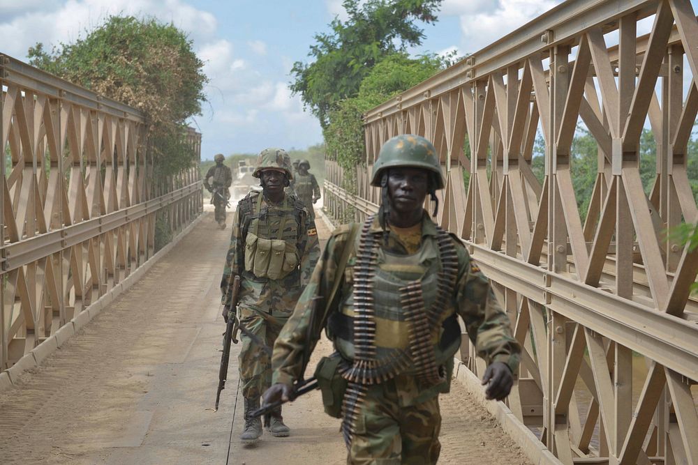 African Union soldiers, as part of the Ugandan contingent of AMISOM, conduct a patrol on April 29 through the town of…