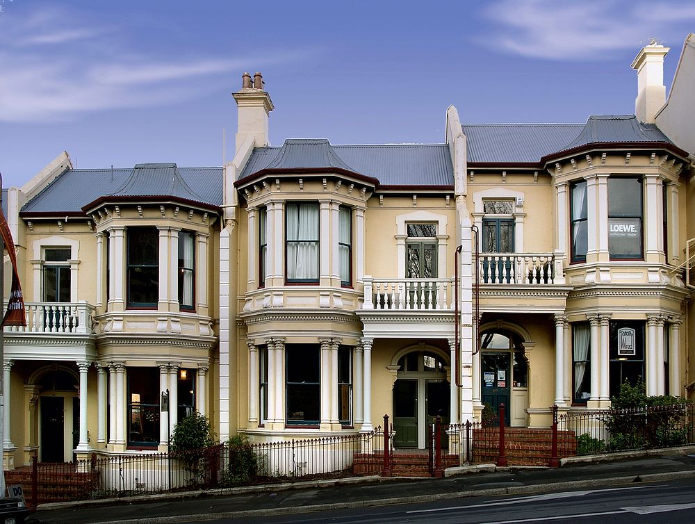 Dunedin. Early homes. Stuart St.Dunedin architect Louis Salmond designed these homes, built for draper Daniel Haynes in…