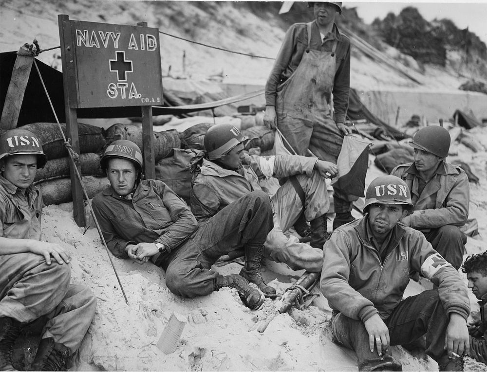 "Navy Aid Station." (D-day) Corpsmen await business on a French invasion beach. 2nd Naval Beach Battallion, Utah Beach.…