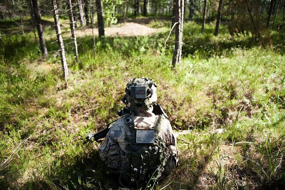 Adazi Training Area, LATVIA - A Latvian Soldier scans the area before him during a situational training exercise defense…