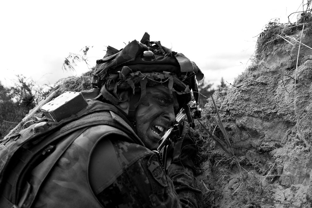 Adazi Training Area, LATVIA &ndash; An Estonian Soldier shouts orders to his teammates during a movement to contact…