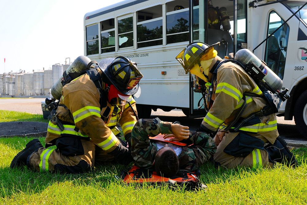 Georgetown County Fire/EMS first responders secure a simulated victim onto a stretcher during a bus crash scenario at a…