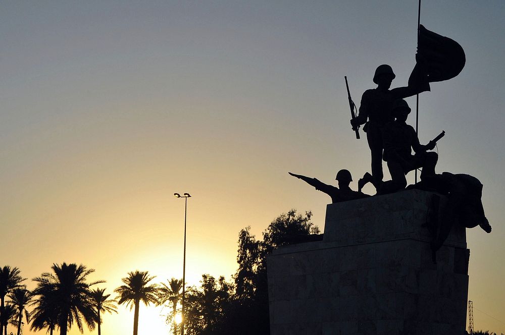 Statue Silhouetted By Setting Sun as Secretary Kerry Returns to Embassy Baghdad.
