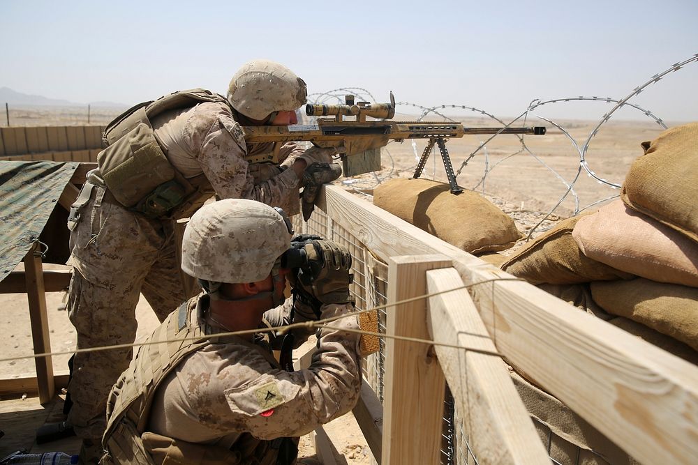 U.S. Marines with Scout Sniper Platoon, 1st Battalion, 7th Marine Regiment man security positions during a mission in…