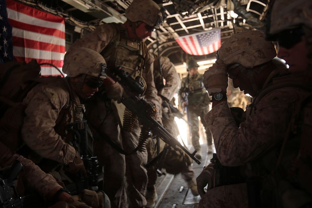 U.S. Marines with Bravo Company, 1st Battalion, 7th Marine Regiment board a CH-53E Super Stallion helicopter during a…