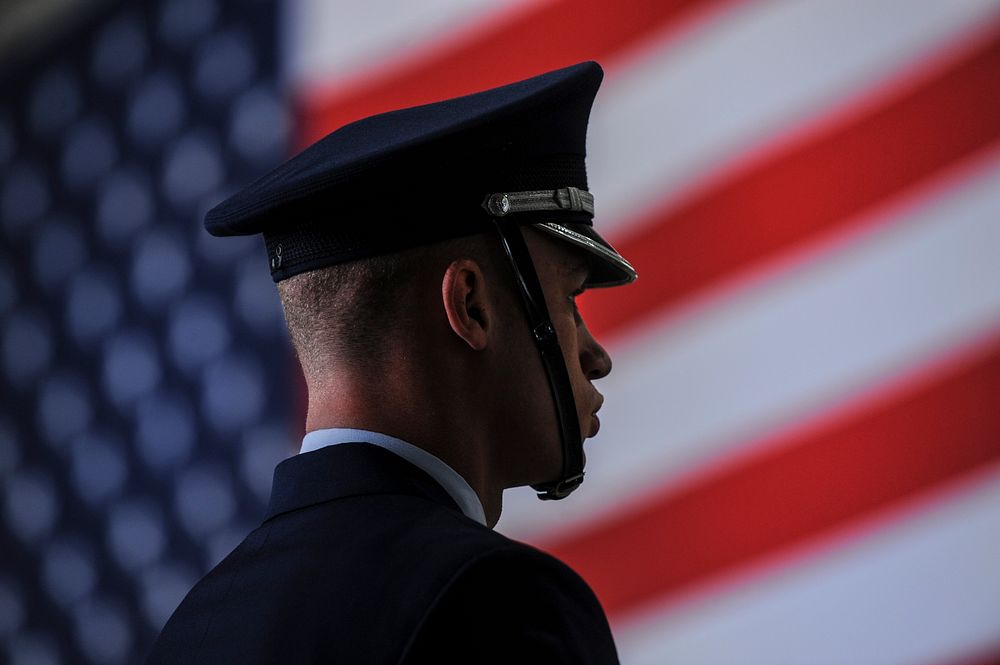 U.S. Air Force Senior Airman Linwood Harrison, a ceremonial guardsman with the honor guard, stands at parade rest before the…