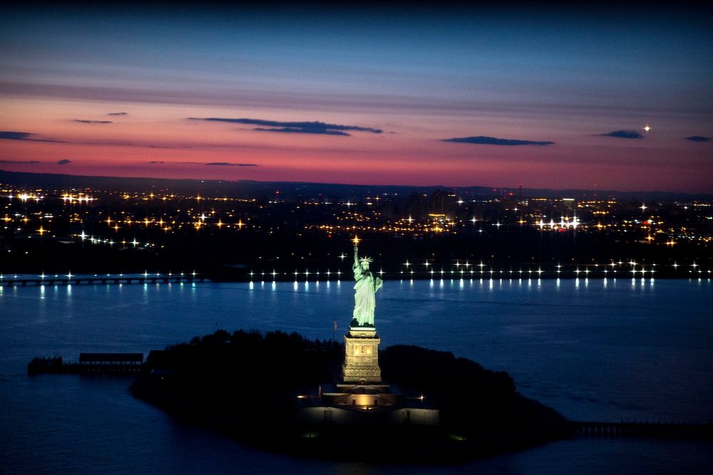 The Statue of Liberty against the New York skyline. Original public domain image from Flickr