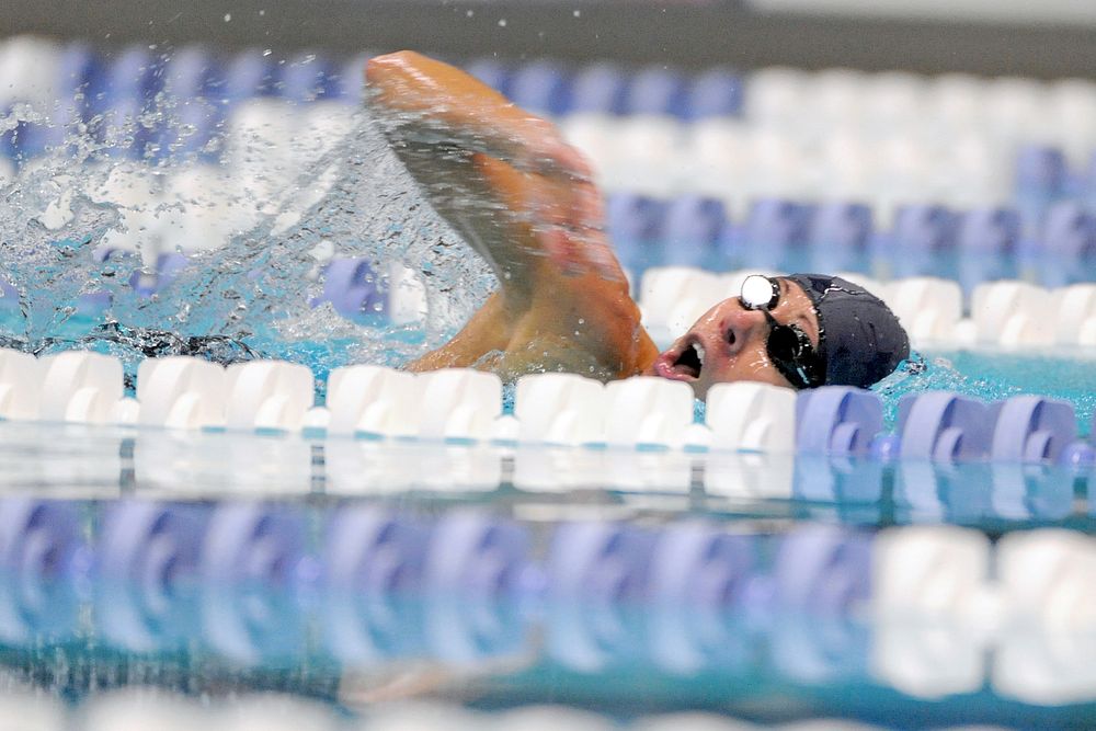 Air Force team&rsquo;s retired Capt. Sarah Evans swims to gold in the 100 meter freestyle swimming event finals during the…