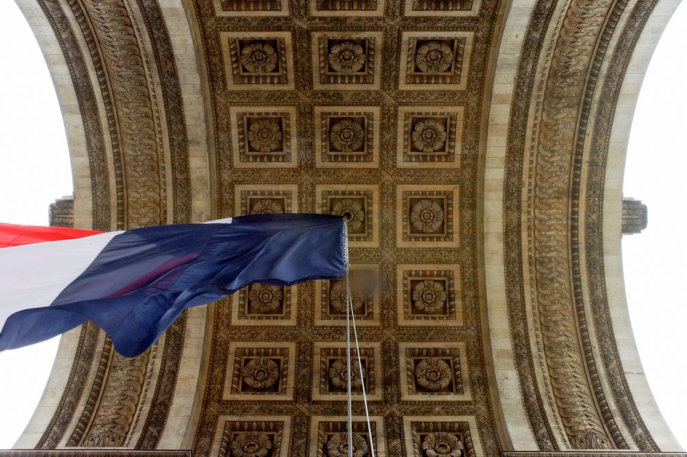 French Tri-Color Flies in Span of Arc d'Triomphe Before 70th Anniversary VE Day Commemoration in Paris.