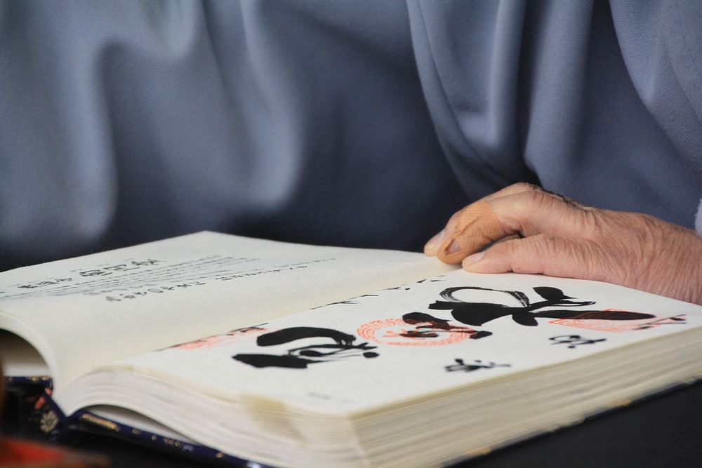 Man reading Japanese book. Free public domain CC0 photo.