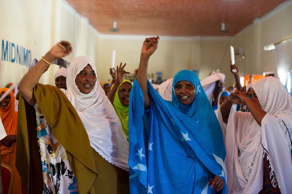 Soomali women singing during a town hall meeting jointly organized by local authorities, Somalia Police Force and AMISOM…