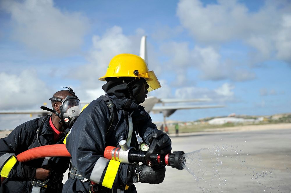 Joint Somali and AMISOM firefighters in a drill conducted upon completion of a refresher training in aviation fire fighting…
