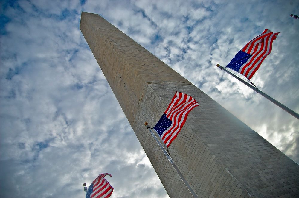 Washington monument with American flags. Original public domain image from Flickr