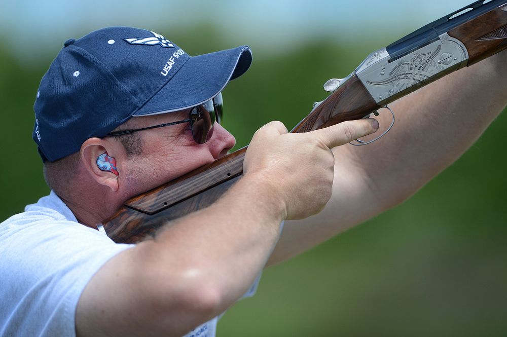 United States Air Force Master Sgt, Joshua Owings, a member of the USAF Skeet Team, shoots during the 2015 Armed Services…
