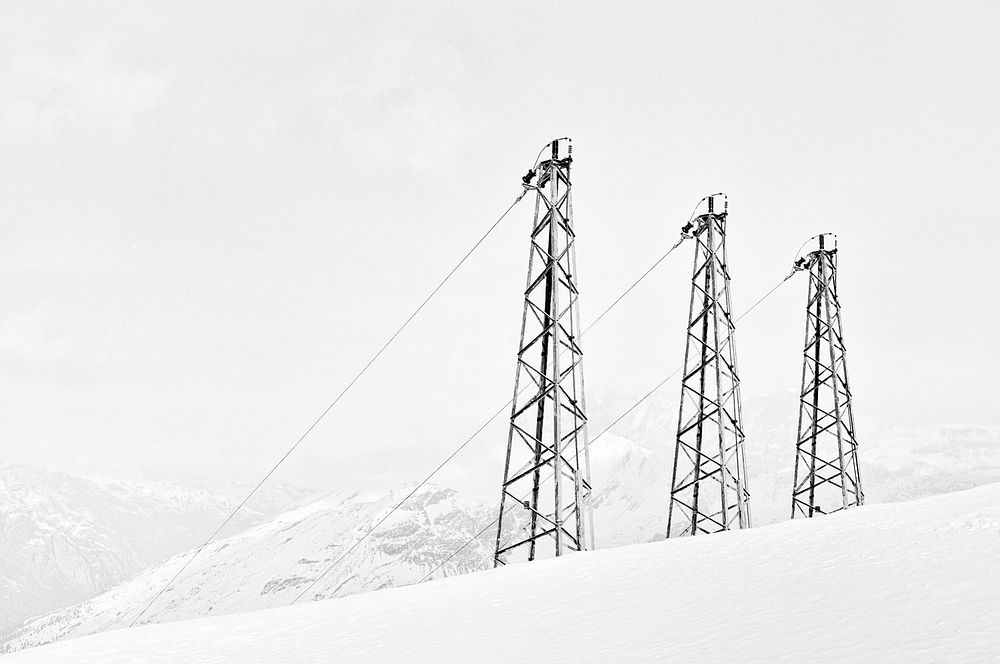Power Lines on a Snow Covered Landscape.
