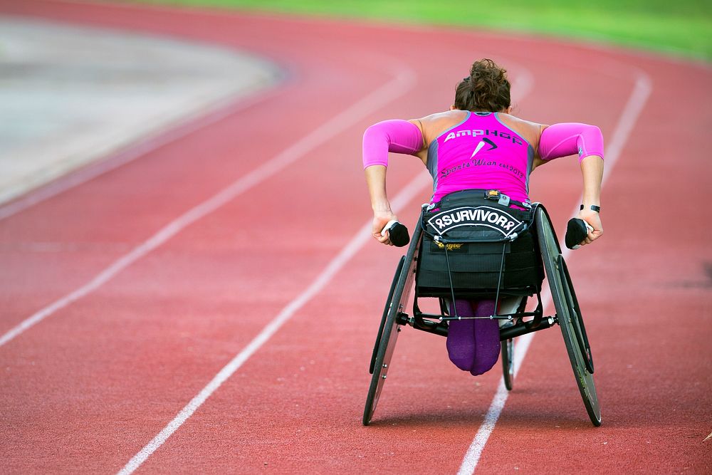 Army Capt. Kelly Elminger does laps in her race wheelchair at Joint Base San Antonio June 11, 2015 while training for the…