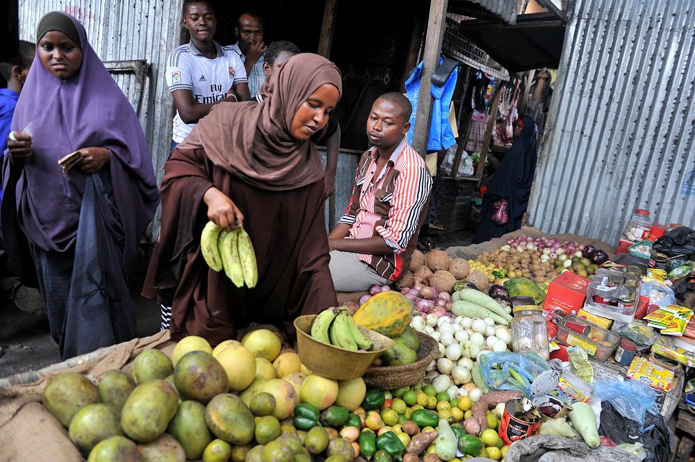 A woman buys fruits at Hamarwayne market in Mogadishu as muslims prepare for the fasting month of Ramadan, the holiest month…