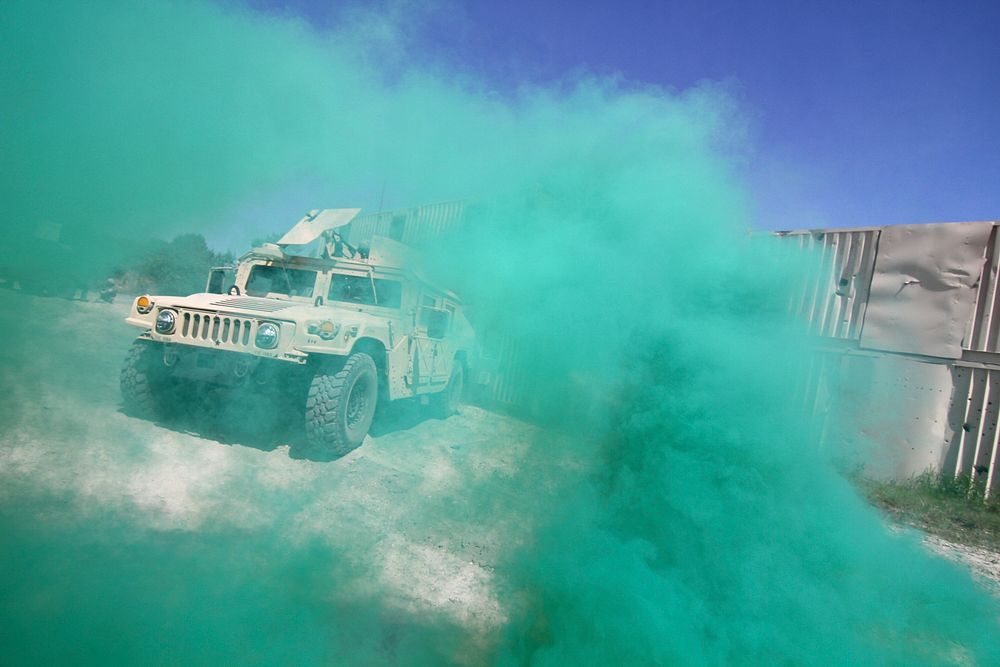 Smoke envelopes a Humvee from the New Jersey National Guard during a Key Leader Engagement scenario on day two of Operation…