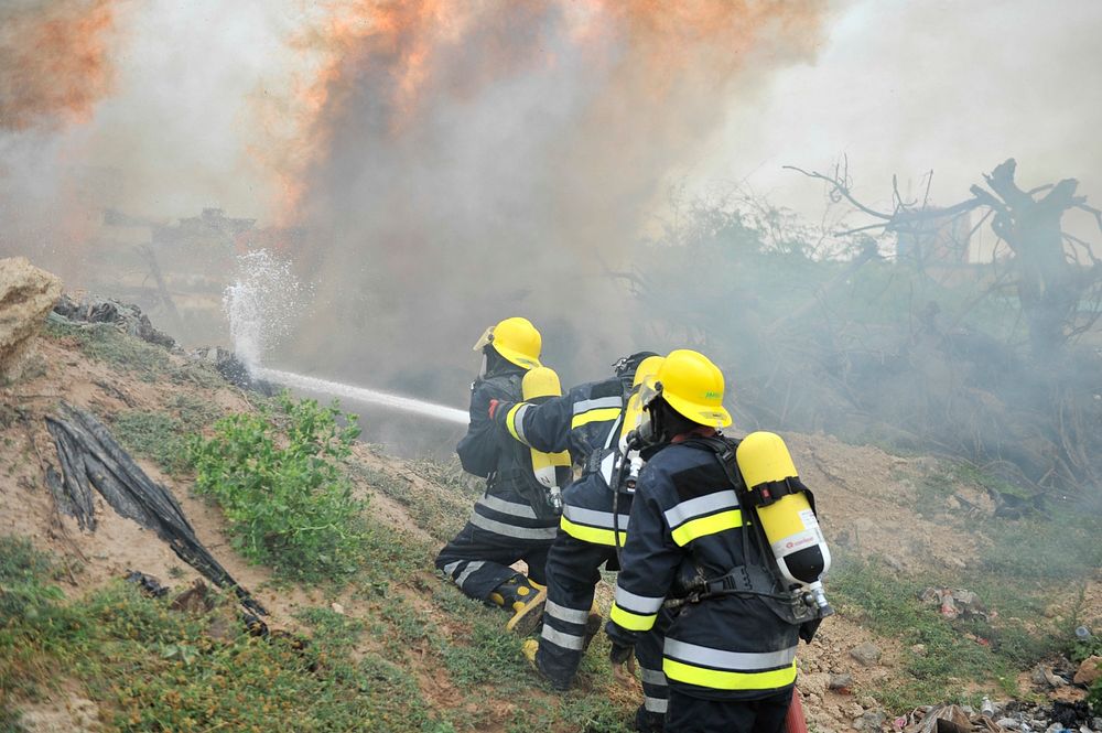 Somali aviation fire fighters demonstrate acquired skills during a fire fighting drill in Mogadishu, Somalia on July 14 2015.