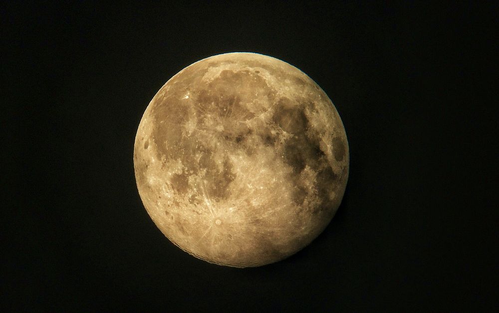 Reddish moonrise on black background. Original public domain image from Flickr