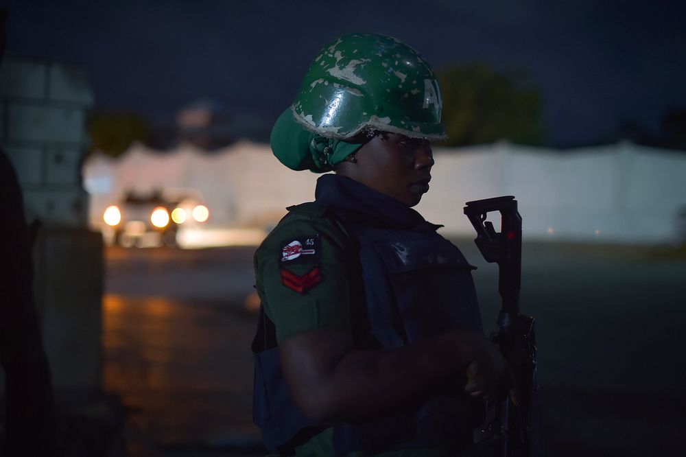 A police woman, belonging to AMISOM, patrols an area of Mogadishu, Somalia, near the city's parliament building on June 30.