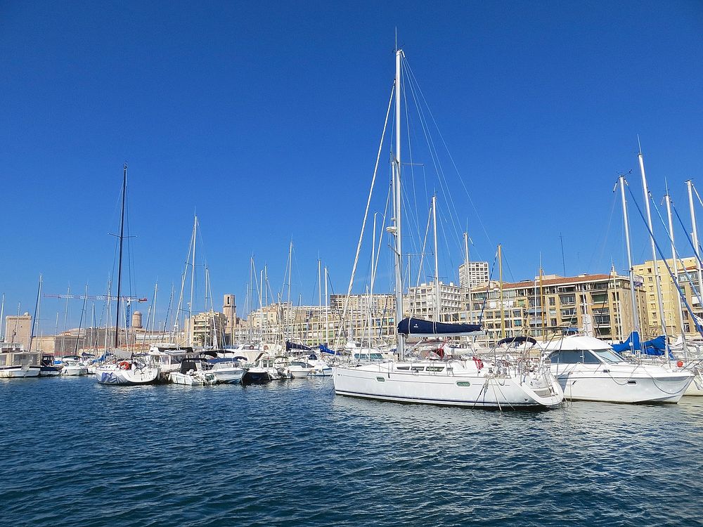 Yacht docking at port in France. Free public domain CC0 photo.