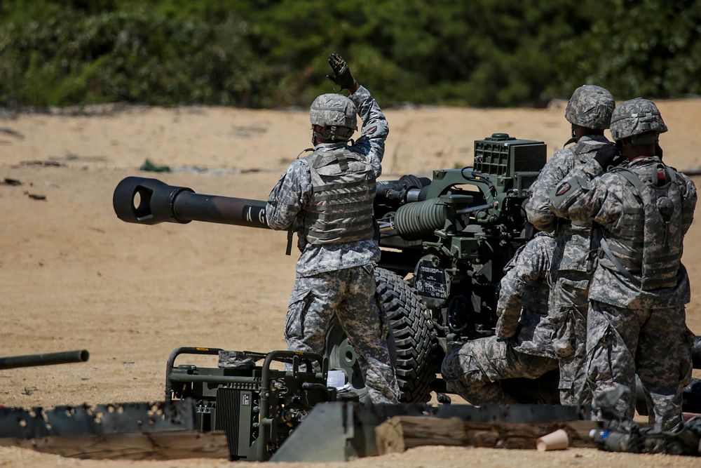 Soldiers from the New Jersey Army National Guard's 3-112th Field Artillery live-fire M119A3 Howitzers at Joint Base McGuire…